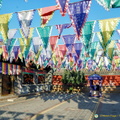 Colourful flags in this courtyard