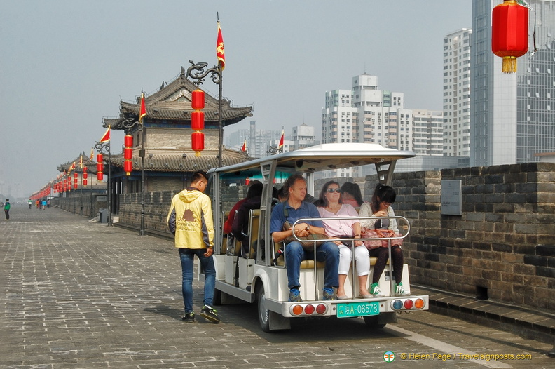 Riders on City Wall Trolley Carts