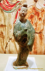 Tri-colour female figure with male garment