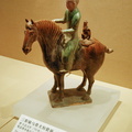 Hunter with dog on horse-back