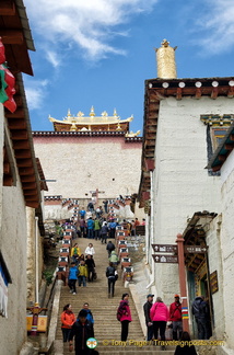 Climbing up to Ganden Sumtseling Monastery