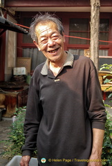Mr. Liu in his eclectic garden