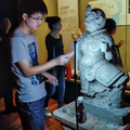 Young sculptor replicating the Heavenly God statue