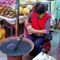 A Stallholder at the Sandouping Village Market